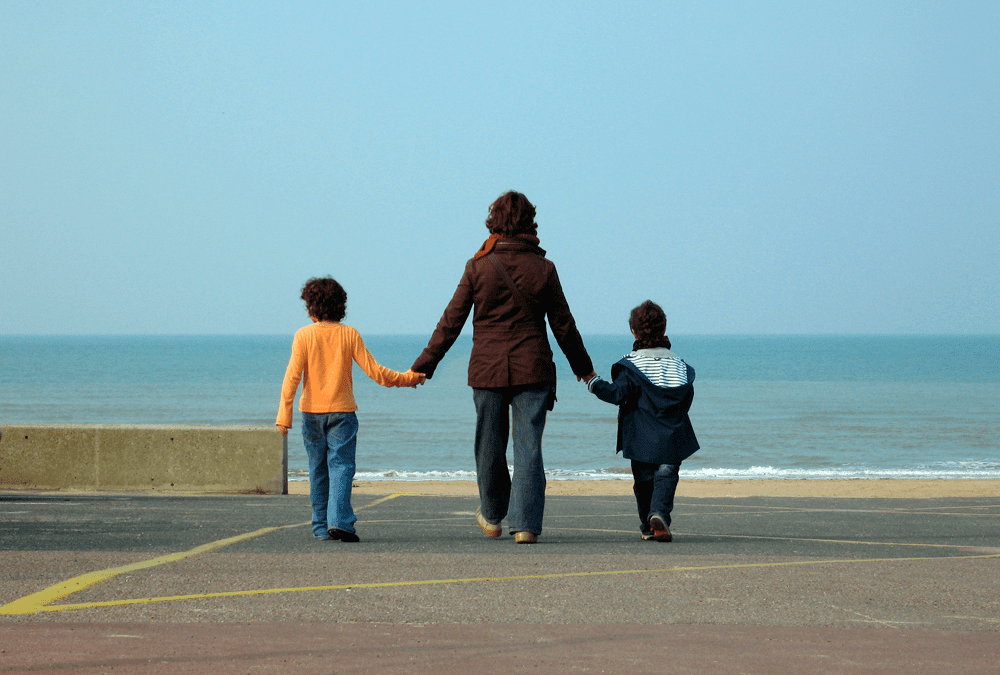 single mother with two kids on sea