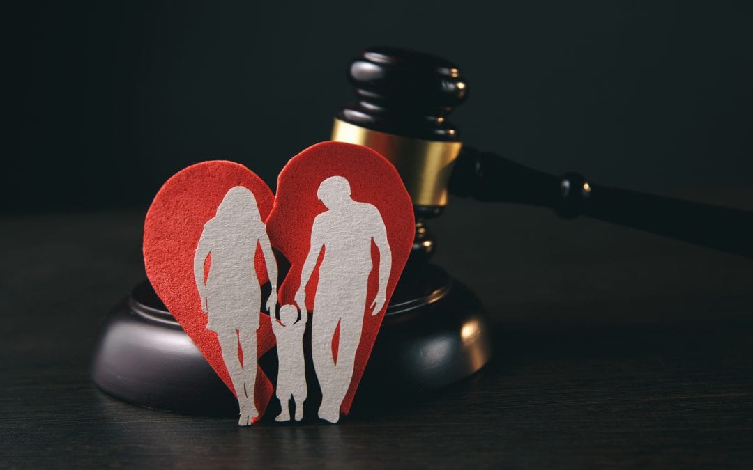 Family figure and gavel on table. Family law