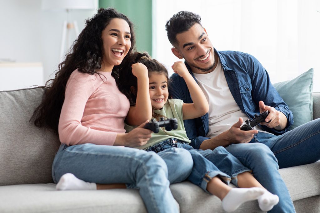 family enjoying and playing ps5